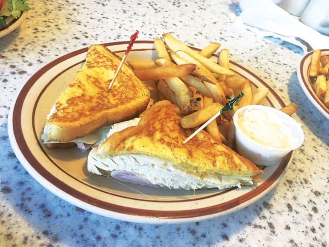 A turkey melt with fries at Olympia Flame in Deerfield Beach.