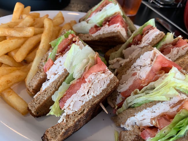 A club sandwich with fries at Nelson's Diner in Pompano Beach.